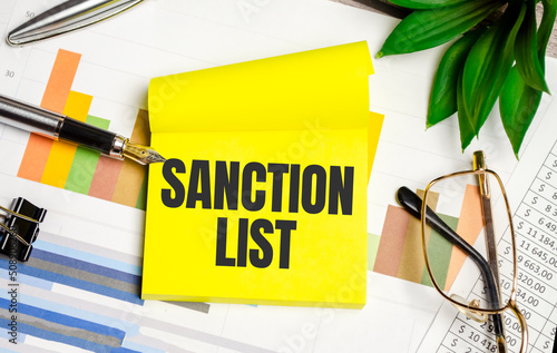 yellow sticker with the text SANCTION LIST and charts