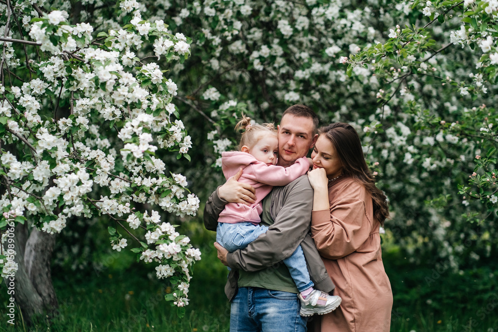 family mom mom baby daughter in the garden blooming apple trees family mom mom baby daughter in the garden blooming apple trees