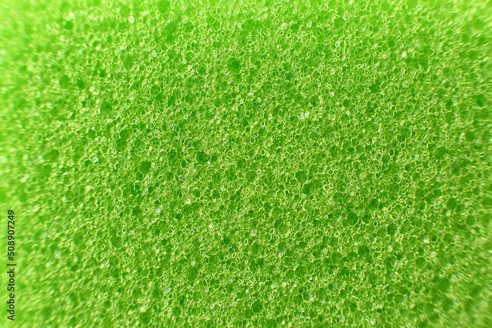 Macro of a bright green sponge, abstract background Macro of a bright green sponge, abstract background