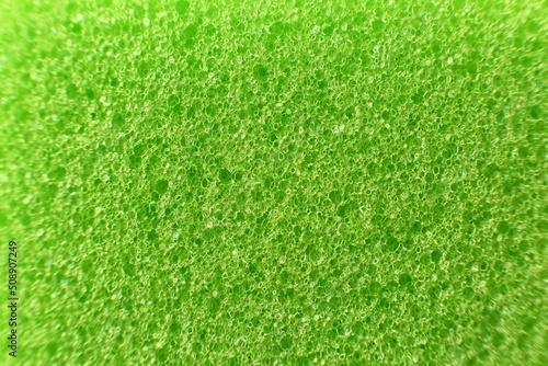 Macro of a bright green sponge, abstract background