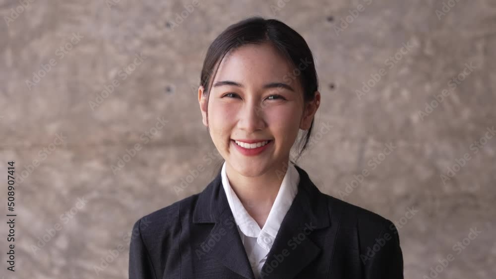 Close up photo of smiling girl slowly looking at the camera Close up photo of smiling girl slowly looking at the camera