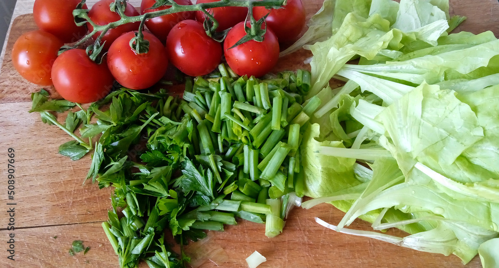 Fresh vegetables for salad or tortilla. Tomatoes, salad, greenery. Fresh vegetables for salad or tortilla. Tomatoes, salad, greenery.
