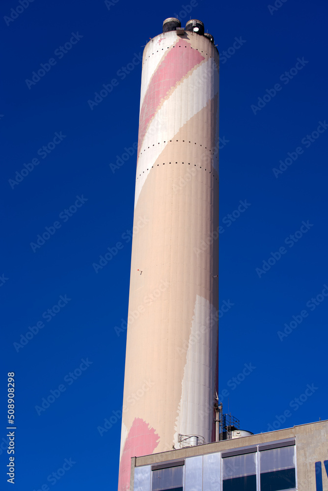 Chimney of Incineration plant at City of Basel on a sunny spring day. Photo taken May 11th, 2022, Basel, Switzerland. Chimney of Incineration plant at City of Basel on a sunny spring day. Photo taken May 11th, 2022, Basel, Switzerland.