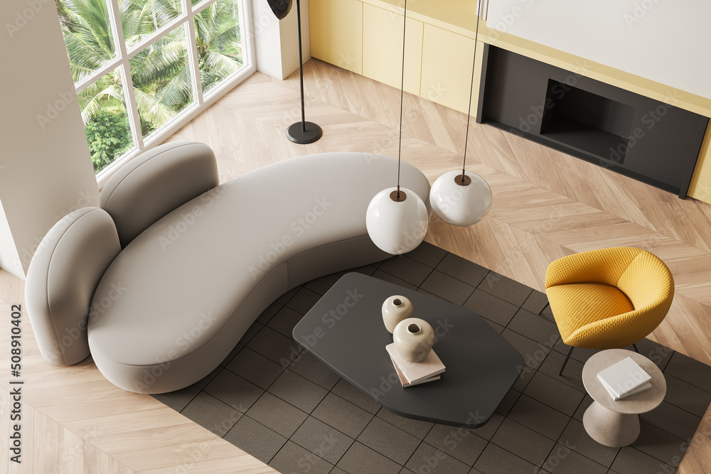 Top view of living room interior with couch and chair, fireplace and