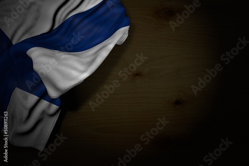 nice labor day flag 3d illustration. - dark picture of Finland flag with big folds on dark wood with empty place for content