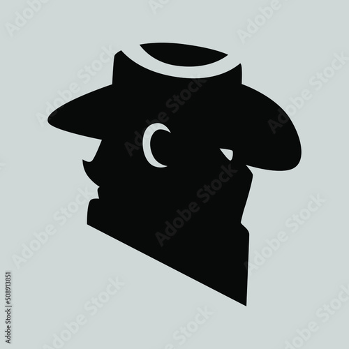 Cowboy masked outlaw symbol side view on gray backdrop. Design element