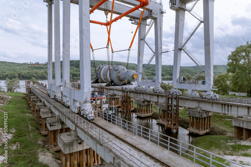 Unloading of the nuclear reactor at the port, moving the nuclear reactor from the ship to the conveyor