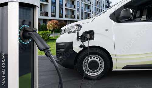 Fotografie, Obraz Electric vehicles charging station on a background of delivery van