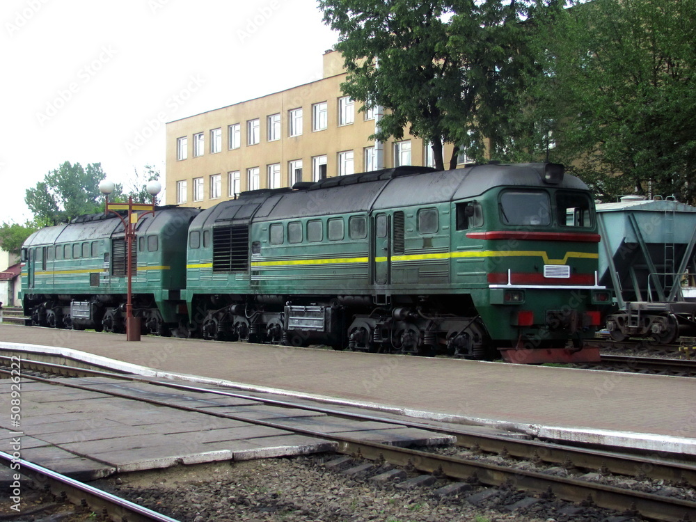 Old locomotive at the train station in the evening