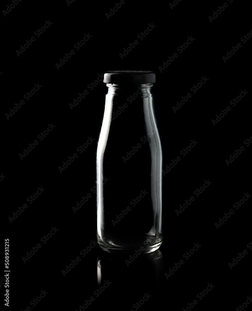 Empty bottle isolated on black background