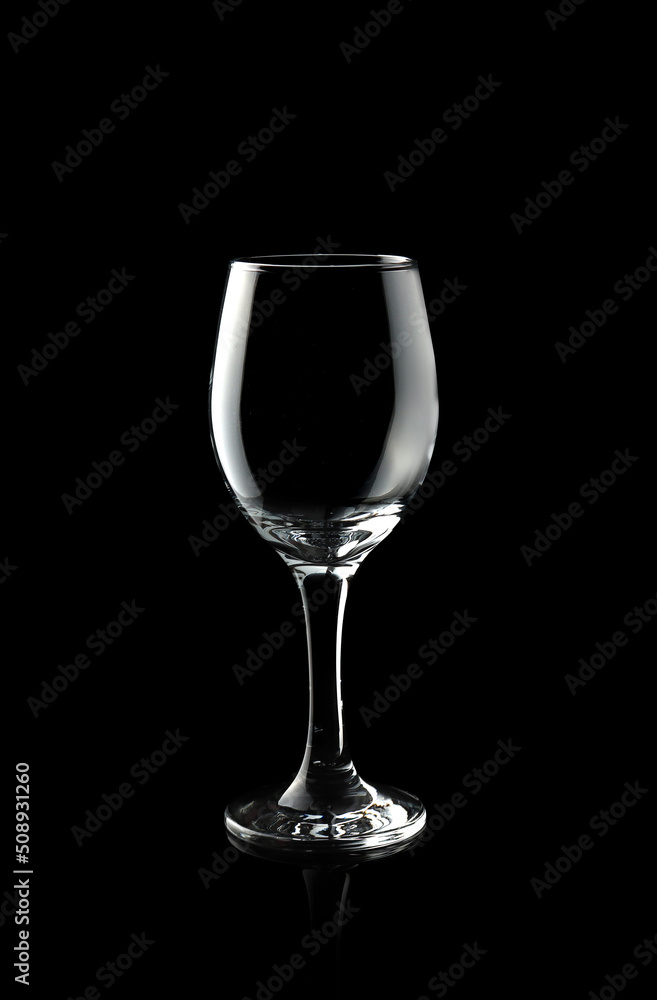Empty wine glass isolated on black background Empty wine glass isolated on black background