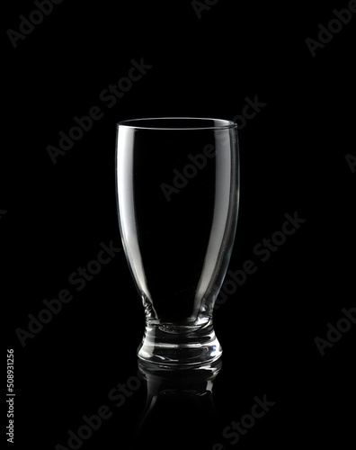 Empty glass of water isolated on black background