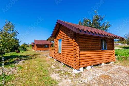 Wooden house for outdoor recreation. Tourist base in the forest. © alexhitrov