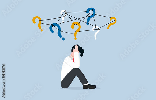 Frustration or depression from complex problems at work, stress or anxiety due to business difficulty concept. Stressed businessman holding his head and sitting on floor with messy question signs.