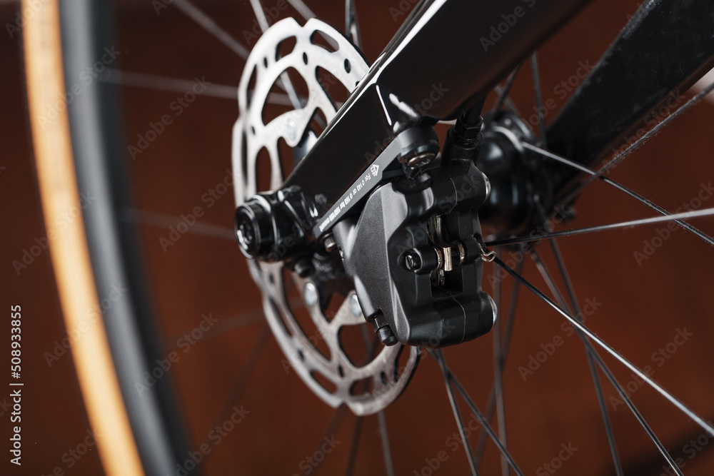 Fototapeta premium Bicycle brake rotor with hydraulic caliper. Brake system on a gravel bike