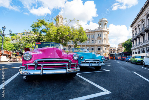 Classic retro cars Chevrolet in different bright colors are parked in front of the national Museum of fine arts on the square, near monument to Jose Marti