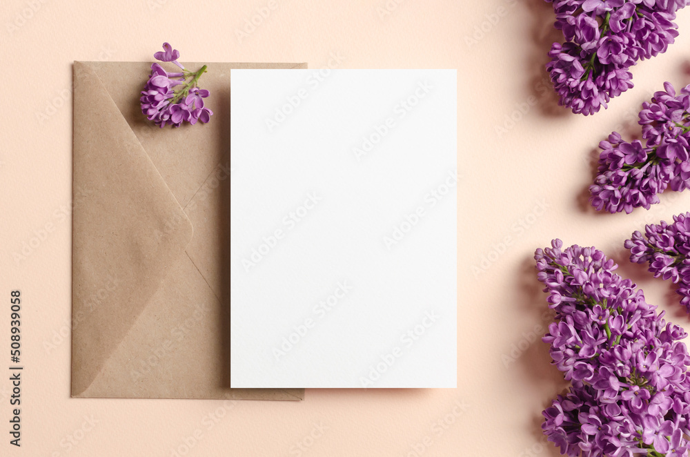 Blank wedding invitation card mockup with envelope and spring lilac flowers Blank wedding invitation card mockup with envelope and spring lilac flowers