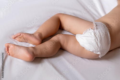 baby in bed. 2 year old baby sleeps in diapers