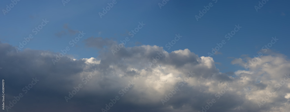 Rain clouds against the blue sky. Rain clouds against the blue sky.