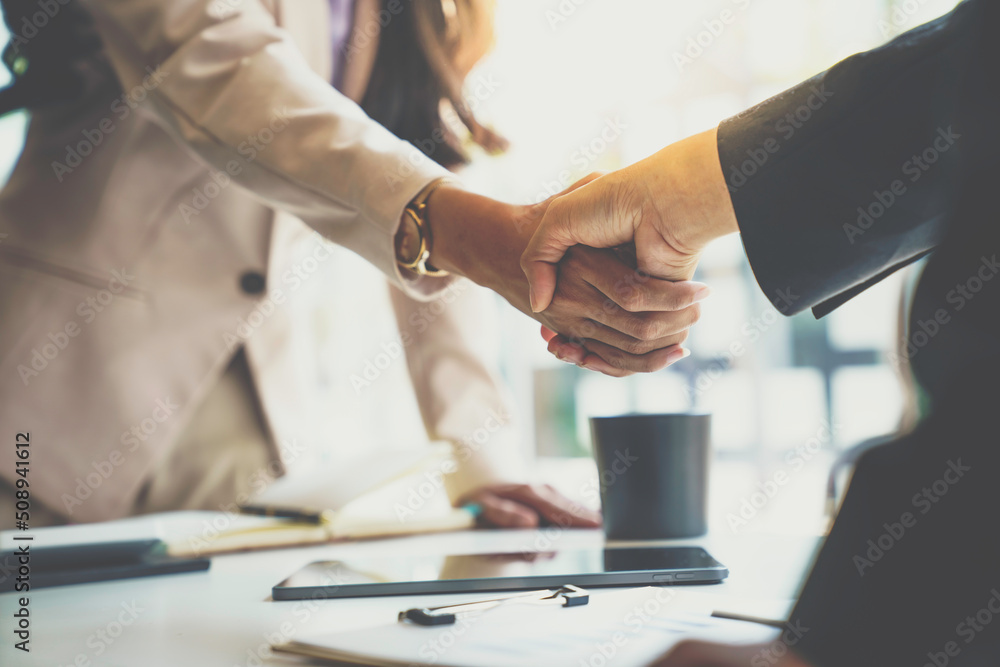 Business partnership meeting concept. Image businessman s handshake. Successful businesswomen handshaking after a good deal. Business partnership meeting concept. Image businessman s handshake. Successful businesswomen handshaking after a good deal.