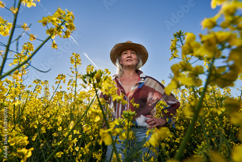 Senior woman in a canola field