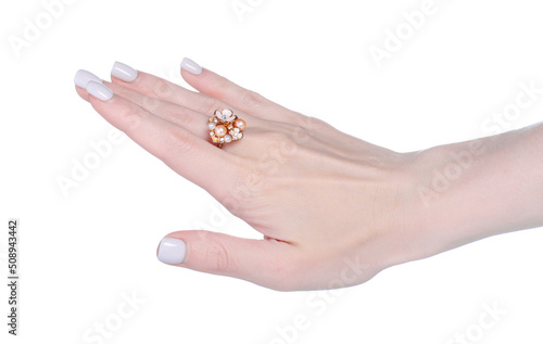 Female hand with ring bijouterie on white background isolation