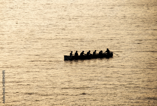 rowers in trawler training in the sea