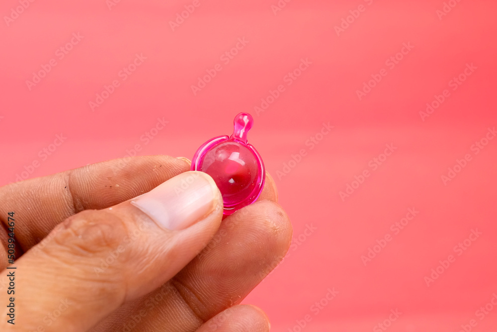 Closeup of hand holding hair vitamin capsules. health care concept. Closeup of hand holding hair vitamin capsules. health care concept.
