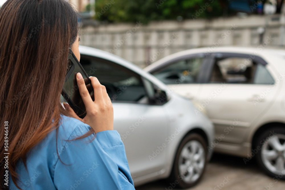 Woman drivers call insurance after a car accident before taking pictures and sending insurance. Online car accident insurance claim idea after submitting photos and evidence to an insurance company. Woman drivers call insurance after a car accident before taking pictures and sending insurance. Online car accident insurance claim idea after submitting photos and evidence to an insurance company.