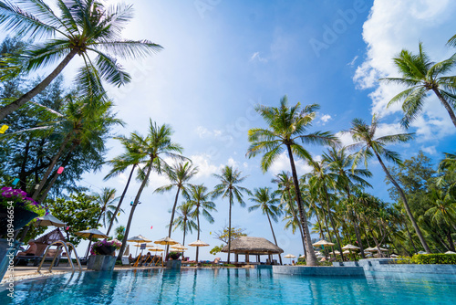 Fototapeta Naklejka Na Ścianę i Meble -  Amazing tropical paradise beach with swimming pools and coconut palms