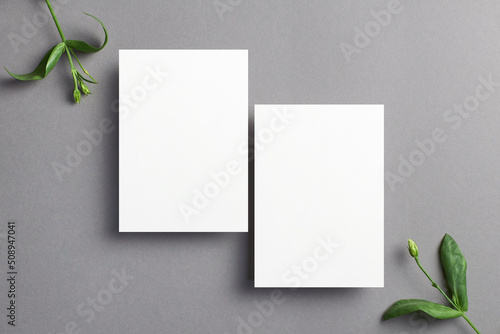 Blank invitation card mockup with front and back sides and botanical decorations