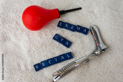 Konstfotografi rectoscope and a red enema bulb with the words enema gyn rectal