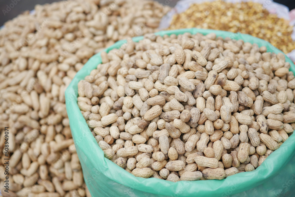 Obraz premium Processed pea nuts in a bowl on table top down .