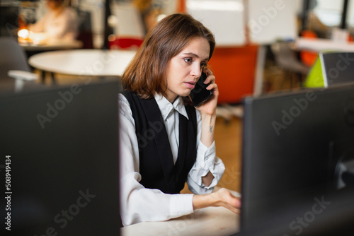businesswoman talking on the phone in the office