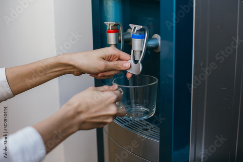 hand with a glass of water