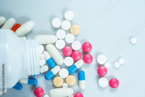 Macro shot of various colored pills on a white background, close-up health care and medical concept