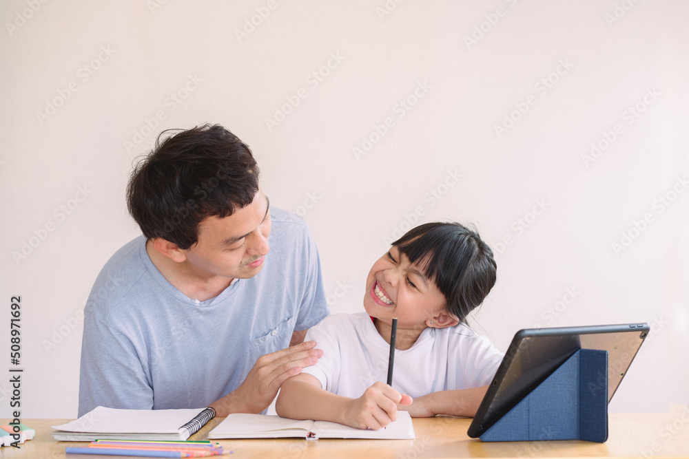 Asian father and daughter using digital tablet holding mobile computer watch cartoons educational online program , Father's day, Asian father and daughter using digital tablet holding mobile computer watch cartoons educational online program , Father's day,