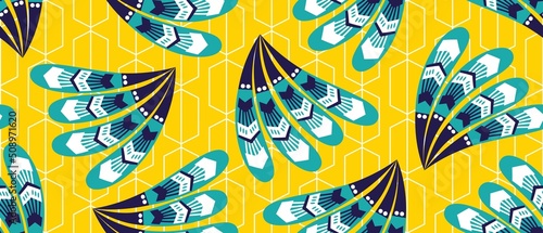 African ethnic traditional yellow background pattern. seamless beautiful peacock Kitenge, chitenge style. fashion design in colorful. Geometric blue feather motif. Ankara prints, African wax prints.