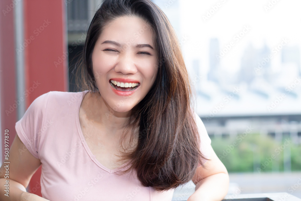 Asian beautiful woman are smiling and laugh with happiness on her leisure day Asian beautiful woman are smiling and laugh with happiness on her leisure day