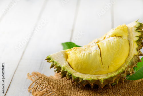 Durian and durian peels  (monthong) on sack and old wood background, photo