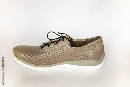 Brown sneakers made of leather on a white background