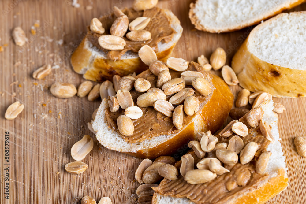 Fototapeta premium wheat fresh baguette and peanut paste