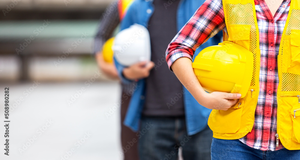 engineer team hold hardhat, safety helmet, for safety teamwork job at construction site in business industrial engineer team hold hardhat, safety helmet, for safety teamwork job at construction site in business industrial
