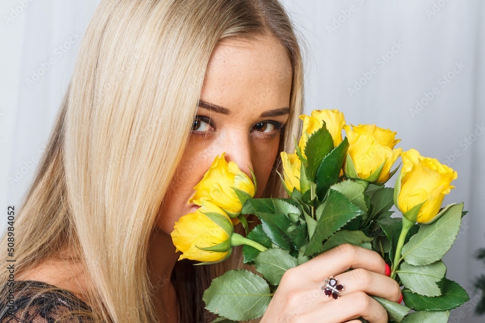 a charming brown look a pretty young woman. the bouquet yellow roses a charming brown look a pretty young woman. the bouquet yellow roses