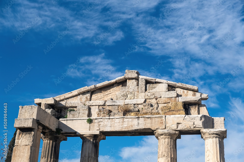Roman Agora, Athens Greece. Gate of Athena Archegetis upper part, blue sky background