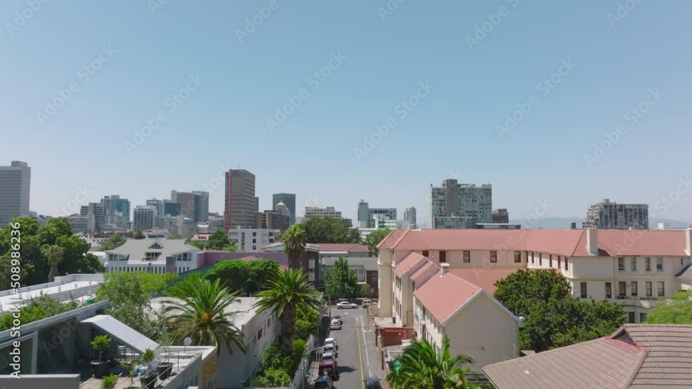 Forwards fly above street in city in tropical destination. Palm trees along streets. Cape Town, South Africa Forwards fly above street in city in tropical destination. Palm trees along streets. Cape Town, South Africa
