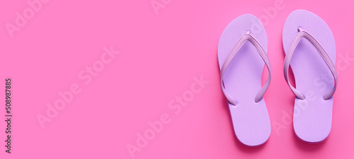 Stylish flip-flops on pink background with space for text, top view