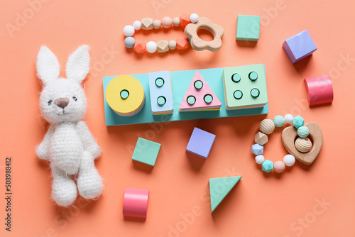 Children toys on orange bac...