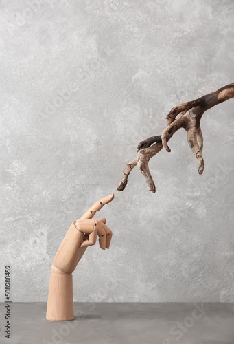 Wooden hand with tree branc...