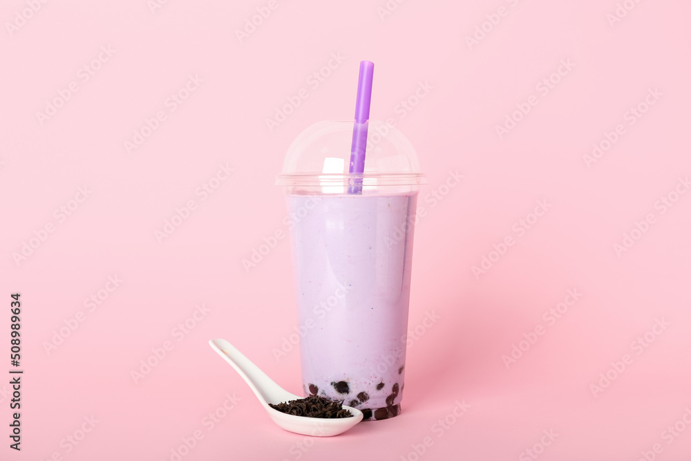 Plastic cup of tasty bubble tea on pink background Plastic cup of tasty bubble tea on pink background